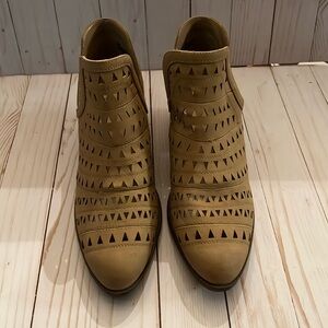 Booties with cut out design. New, never worn.